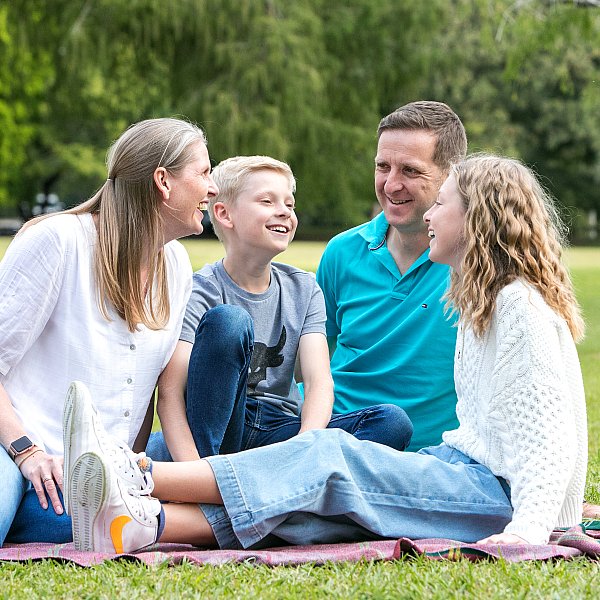 candid natural family portrait outdoors park location